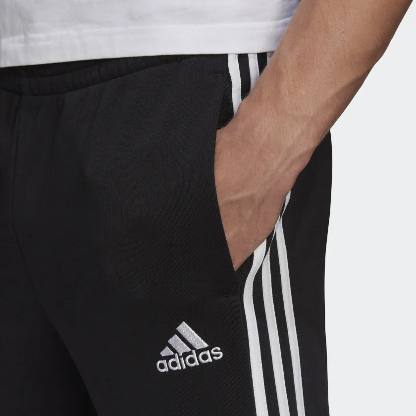 ADIDAS SPORTSWEAR PANTALONI ESSENTIALS FRENCH TERRY TAPERED CUFF 3-STRIPES - immagine 5