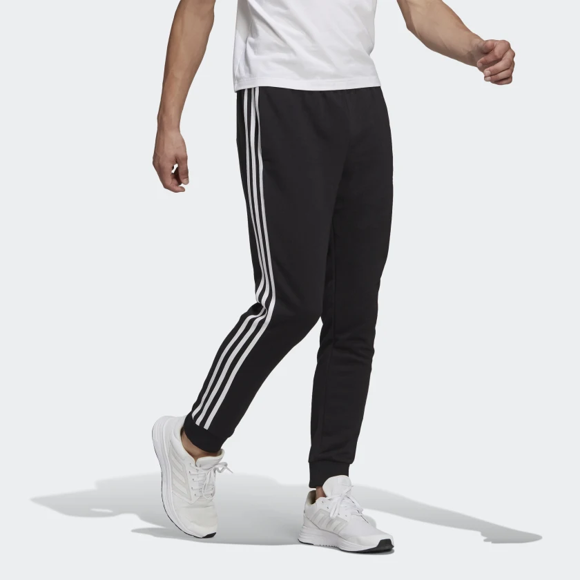 ADIDAS SPORTSWEAR PANTALONI ESSENTIALS FRENCH TERRY TAPERED CUFF 3-STRIPES - immagine 3